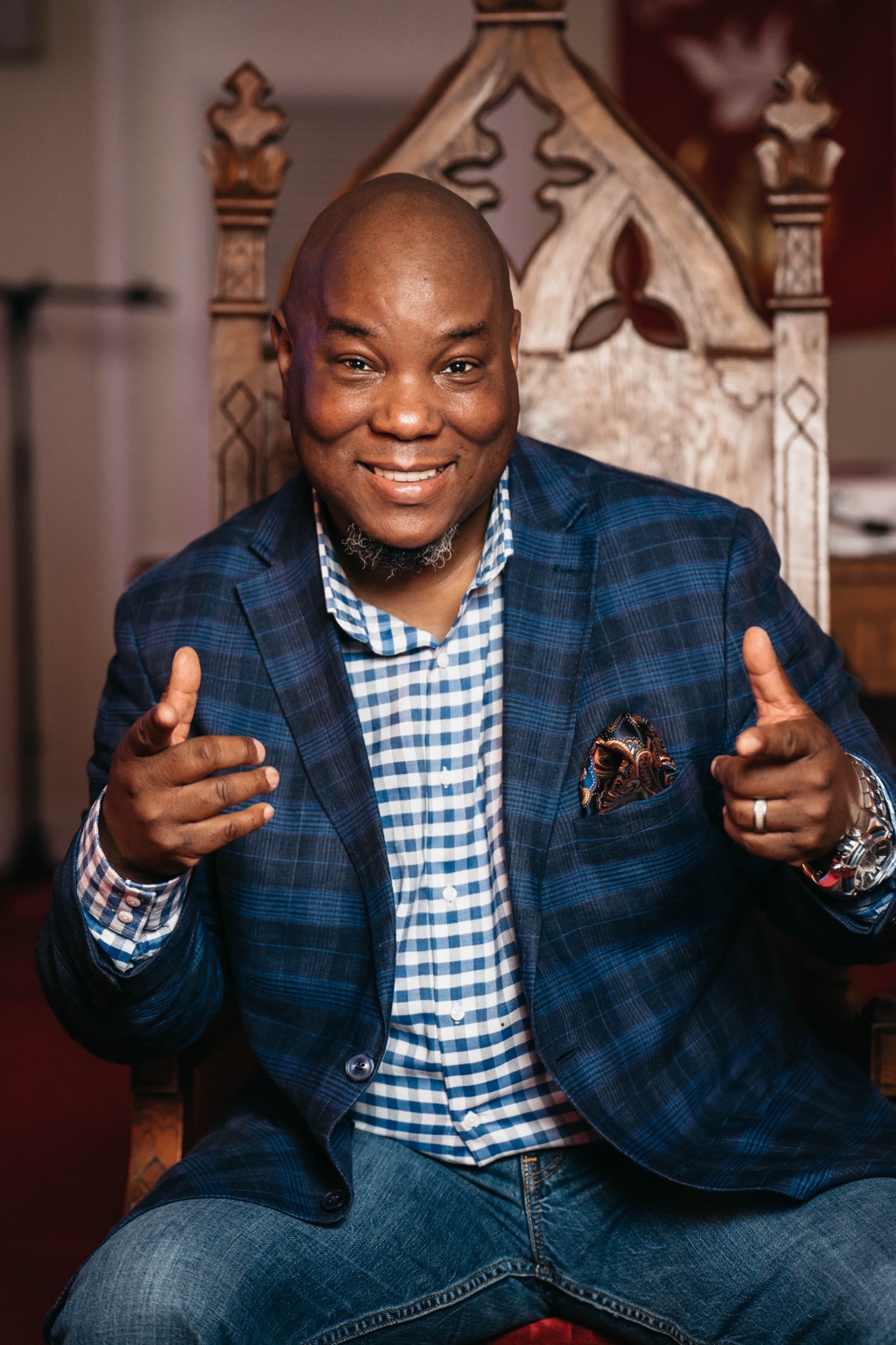 Pastor Sean smiling and seated